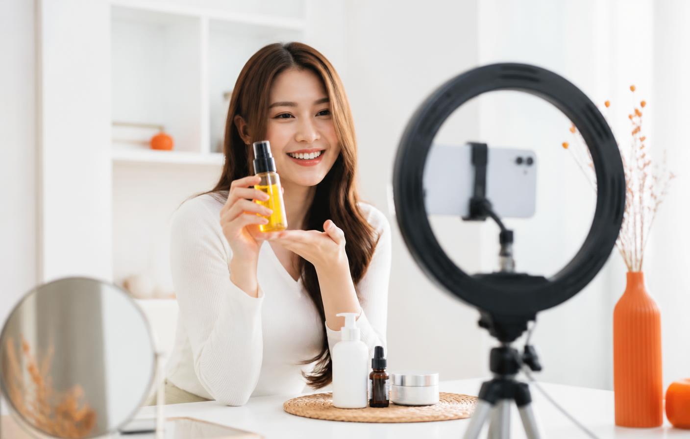 Content creator filming a short-form product video in a bright studio